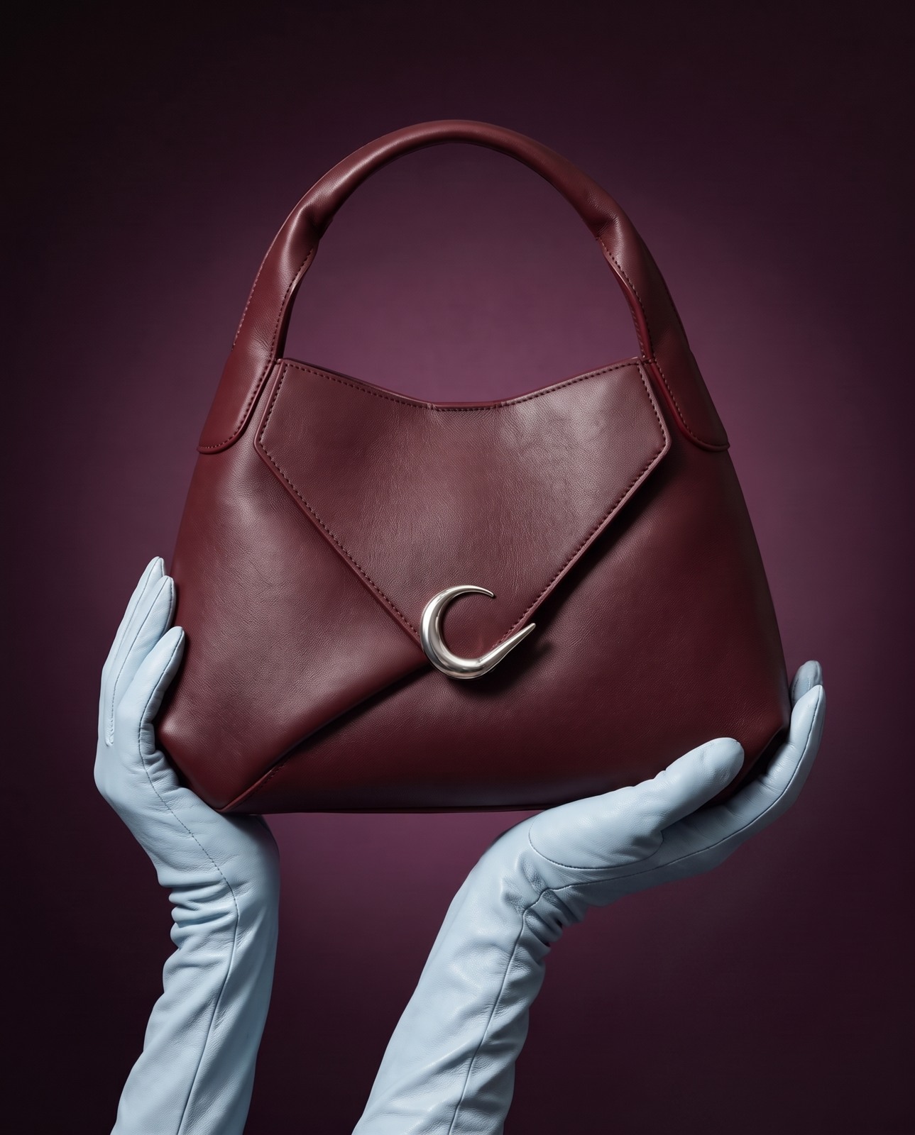 AI-generated burgundy handbag campaign with powder-blue gloves and a deep plum backdrop