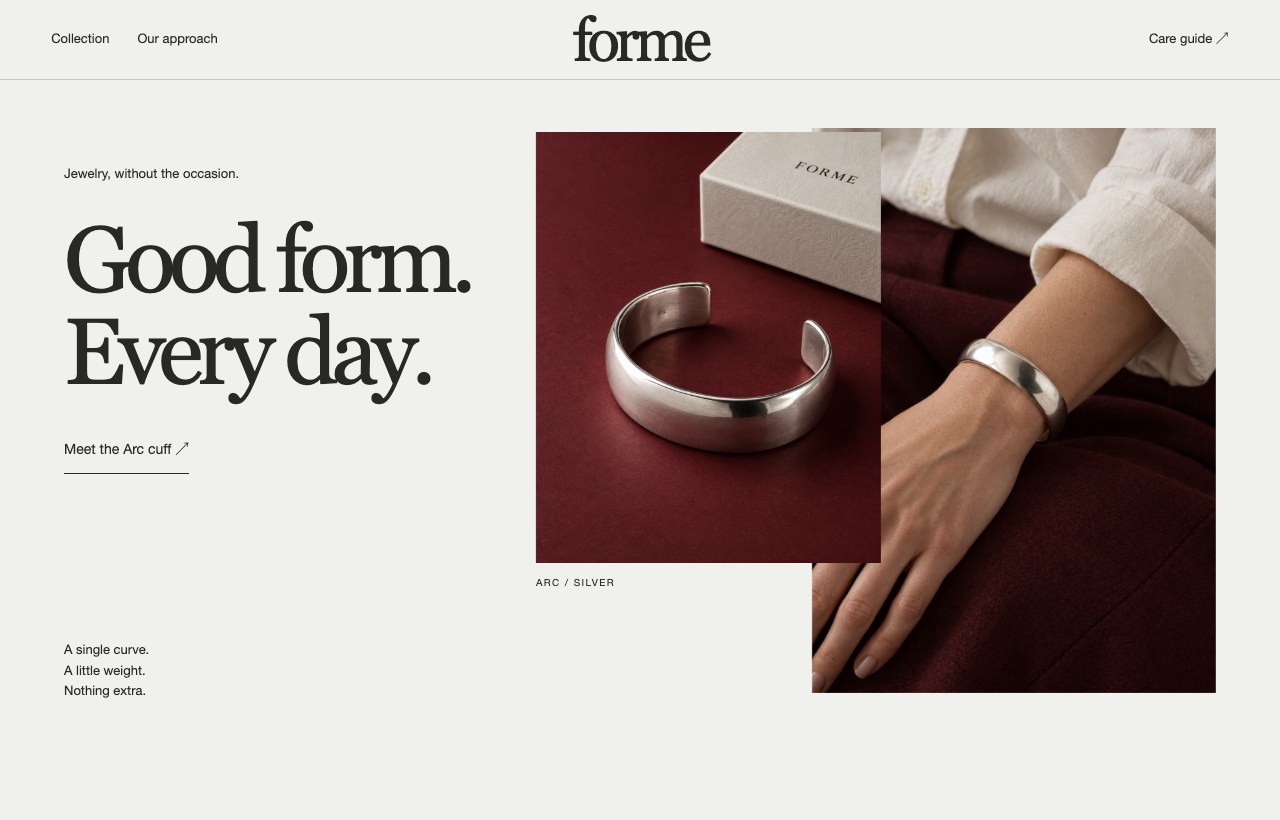 A jewelry website with burgundy tones, reflective silver and a focused collection story.