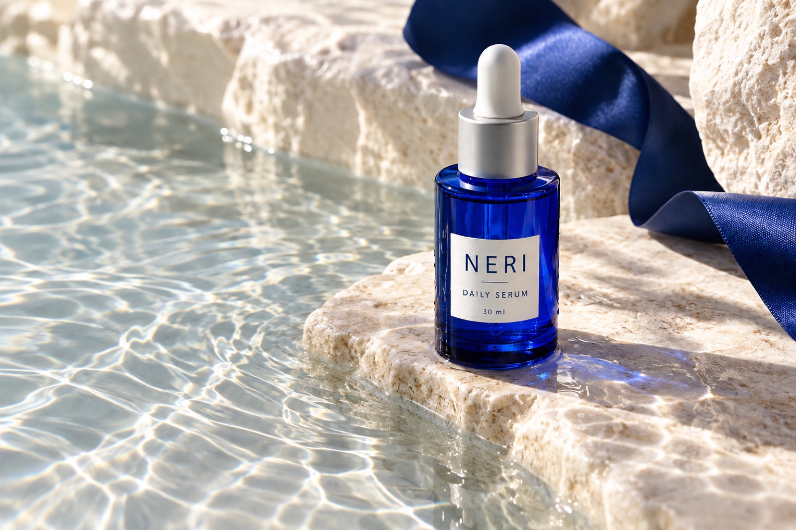The NERI serum still that the presenter holds up in the avatar ad.