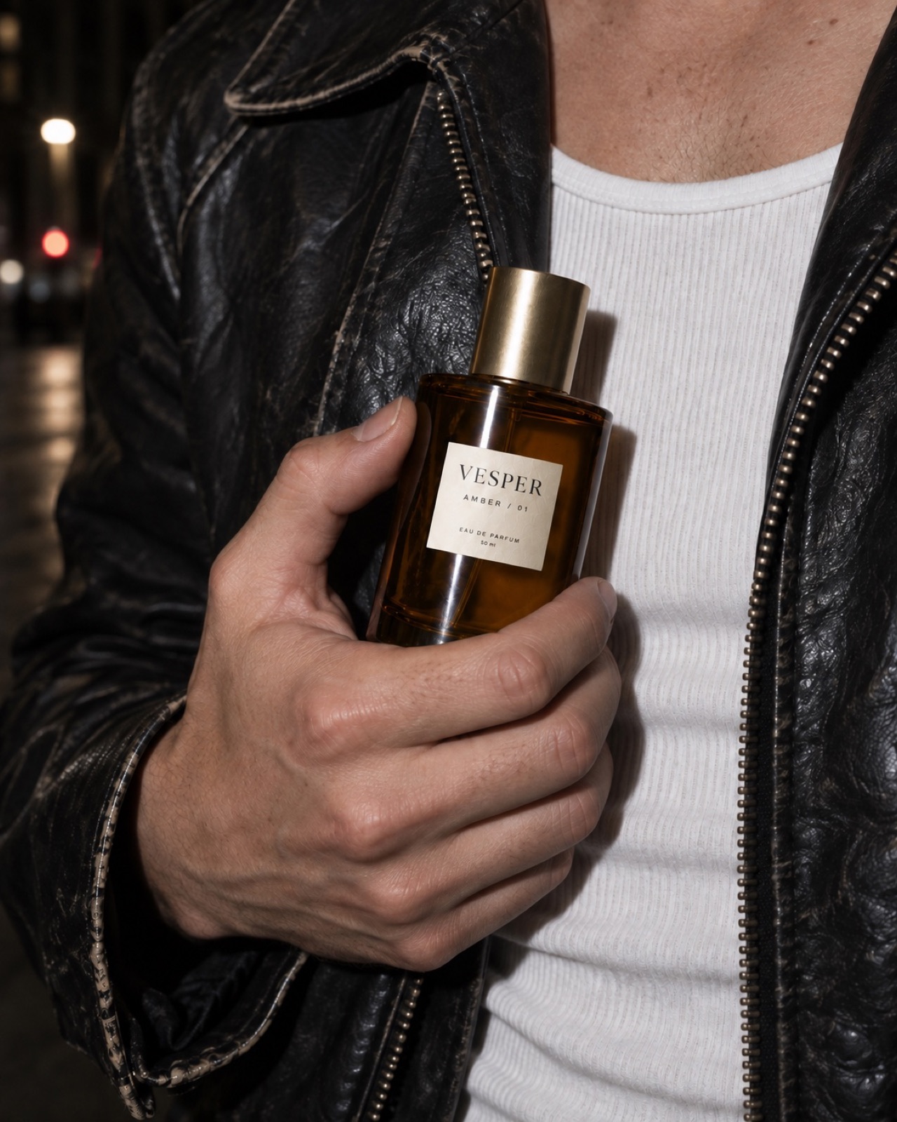 The bottle in a hand, direct flash, the b-roll for the body.